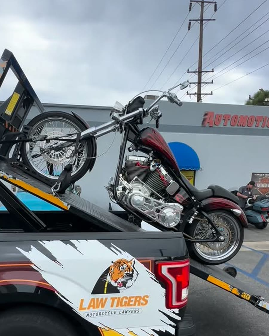 Custom red and black cruiser on Law Tigers lift at Automotion