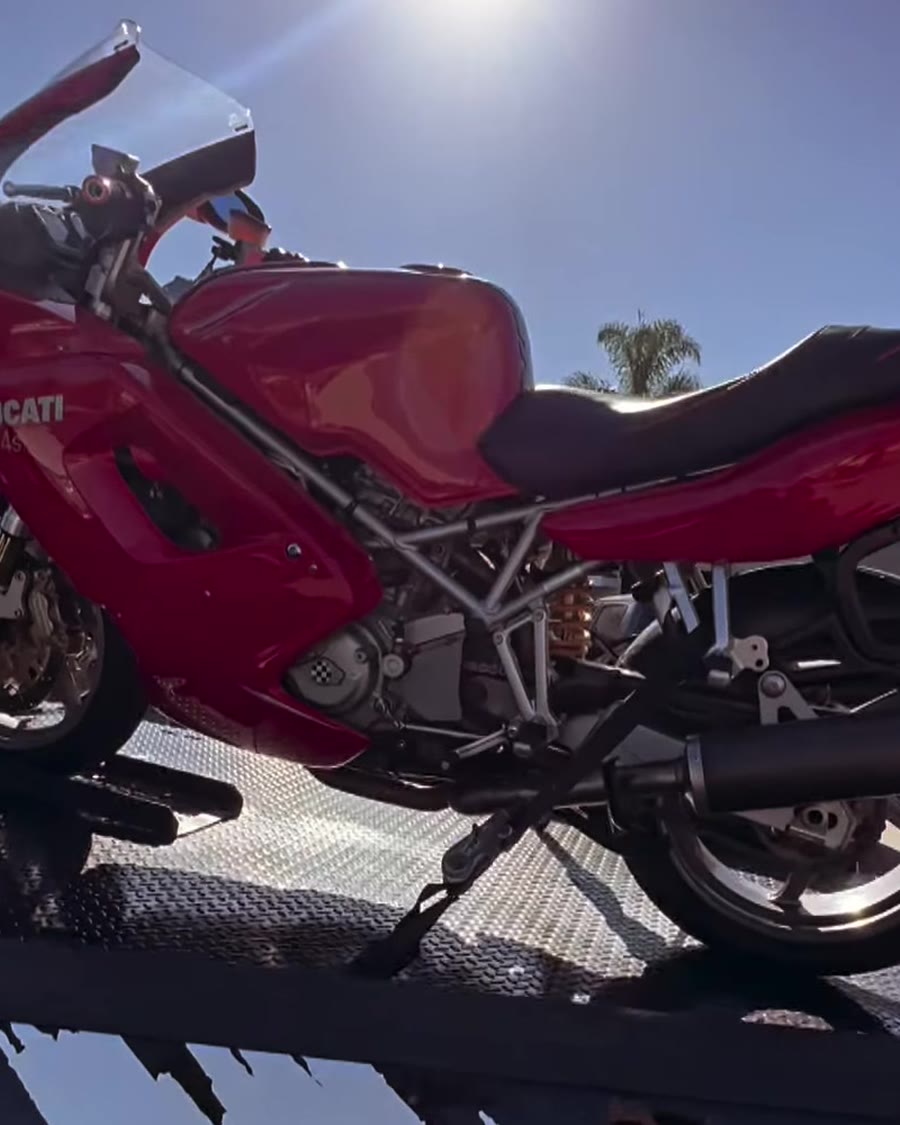 Red Ducati ST4s strapped on Law Tigers black truck bed