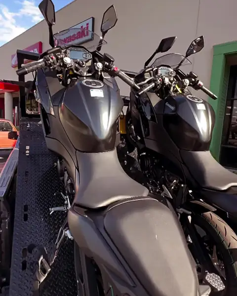 Two Kawasaki Ninjas on the bed