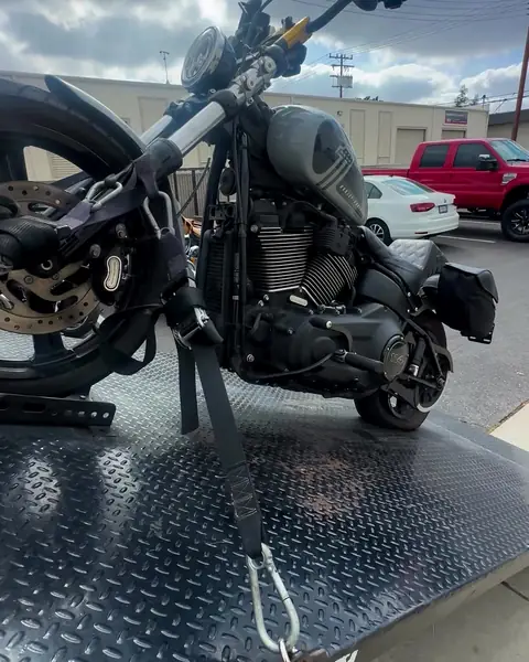 Bike strapped on the diamond-plate bed