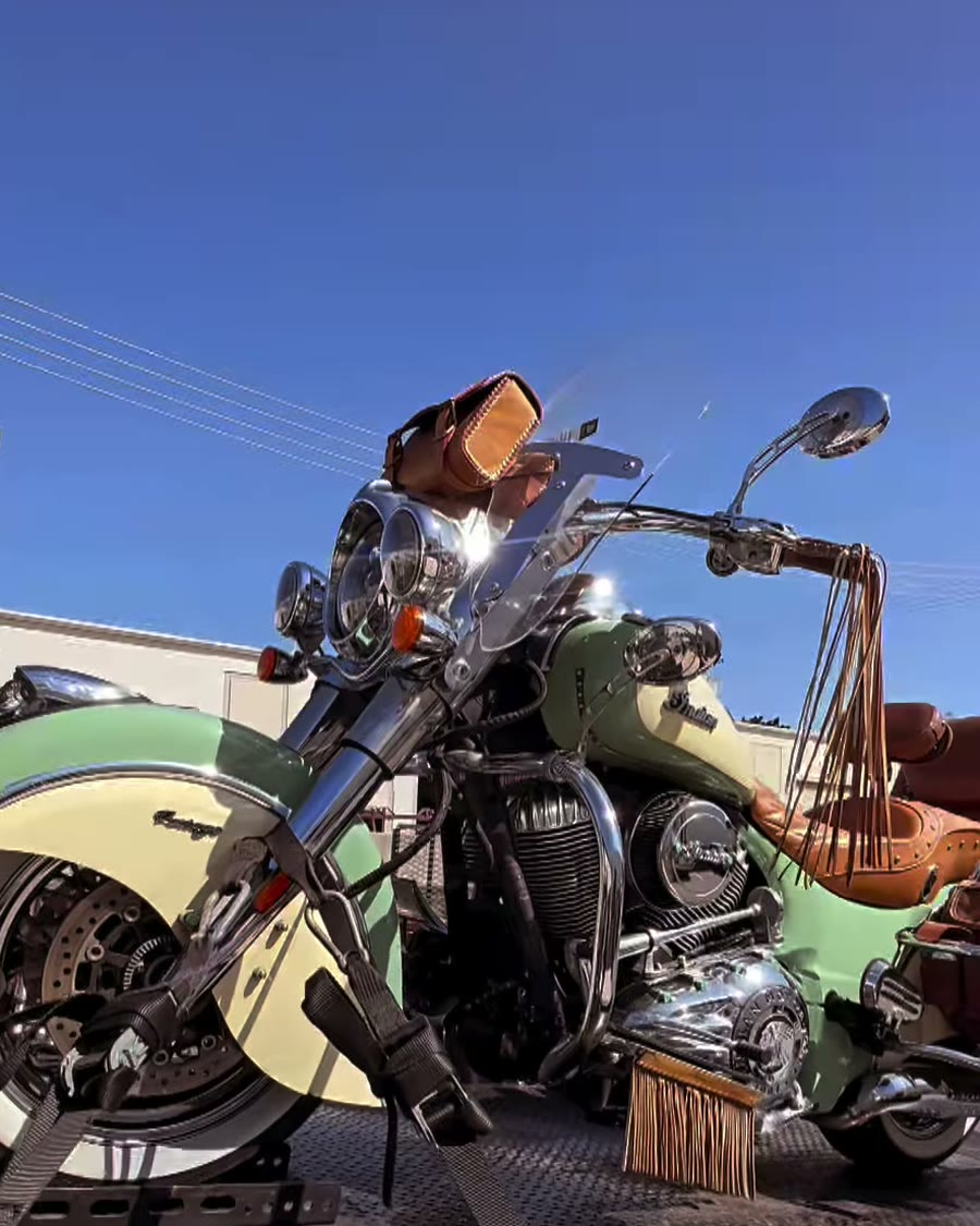 Mint green Indian Vintage secured on black tow bed